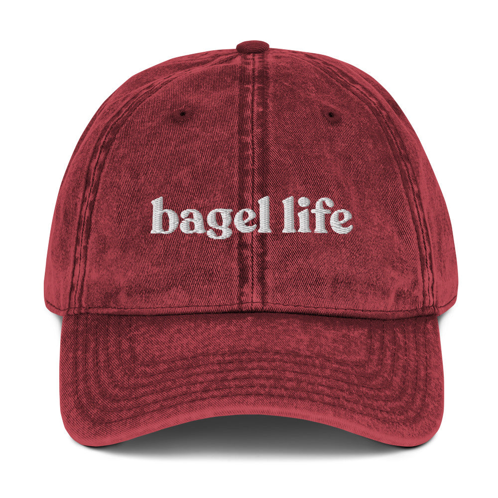 Maroon Bagel Life Hat - Living that bagel life? Looking for a gift for a bagel enthusiast? This bagel hat might be just for you. It's a funny bagel hat that's expertly embroidered and made just for you. Make a statement and eat your favorite bagels in this funny Jewish hat. The perfect foodie hat for bagel lovers and foodies of all kinds.