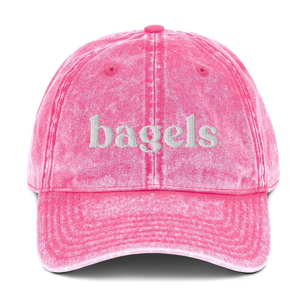 Pink Bagels Hat - Love bagels? This bagels hat is adjustable, comfortable and made just for you. It's a classic dad hat with "bagels", expertly embroidered on the front. Eat bagels and make a statement in this funny hat for bagel lovers. Perfect for everyday streetwear or a gift for a bagel enthusiast.