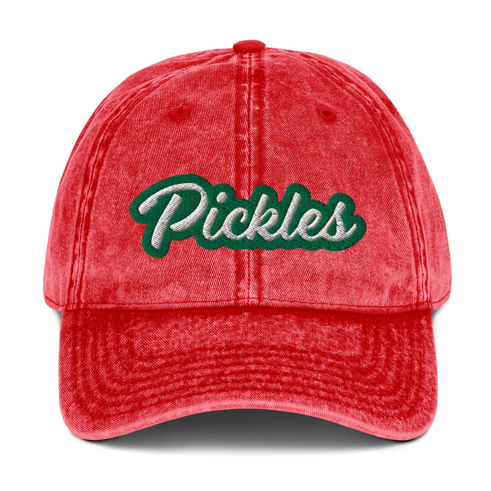 Red Pickles Hat - Upgrade your hat game with the Pickles Hat. It's a classic dad had with a funny design, expertly embroidered on the front. Show off your sense of humor and love for pickles with this unique accessory. It's sure to turn heads and have people asking where you got it.