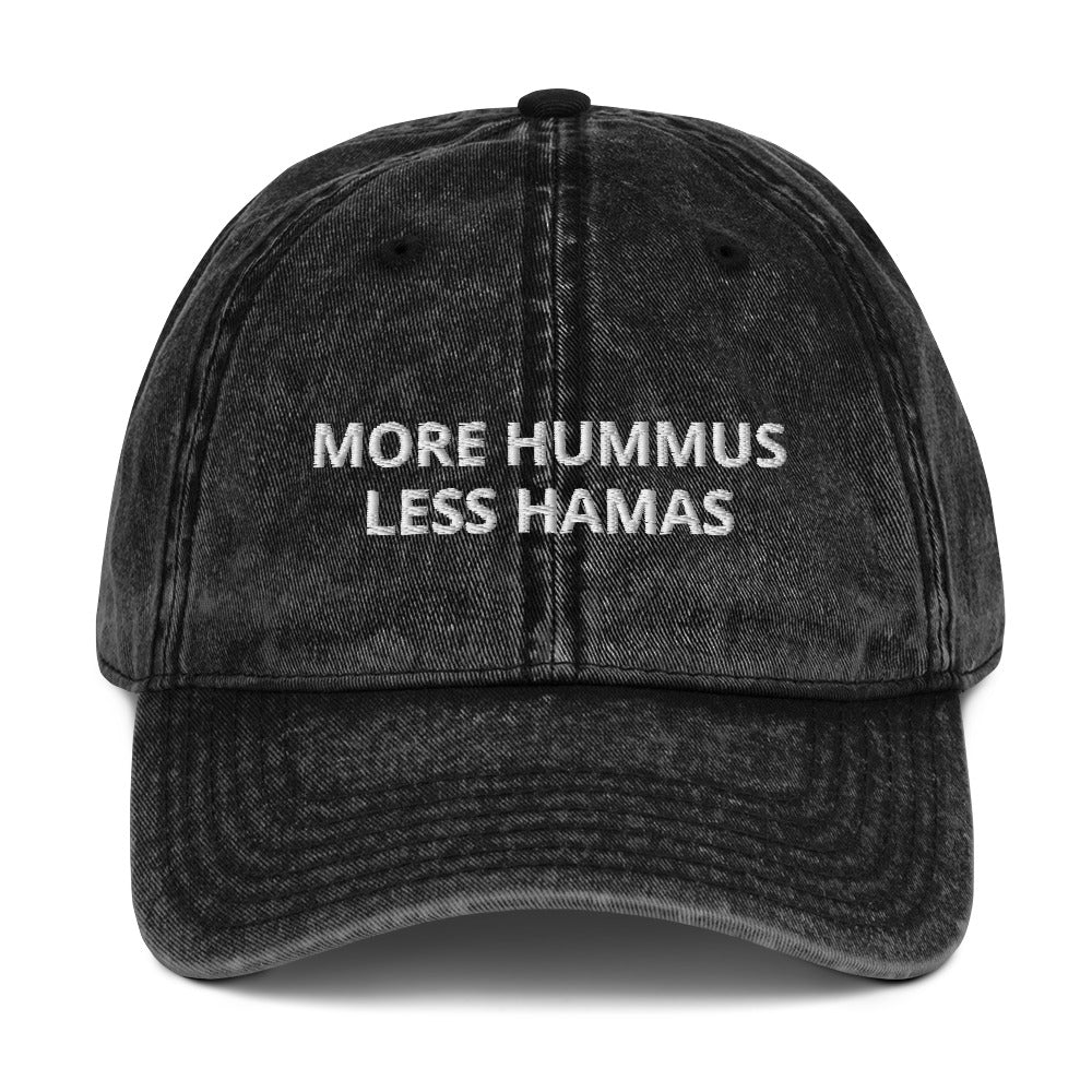 Black More Hummus Less Hamas Hat - Hamas sucks! Let your hat do the talking in this More Hummus Less Hamas Hat. It's a comfortable cotton hat with an anti-Hamas saying, expertly embroidered on the front. Stand out and make a statement in this classic dad hat against terrorism.