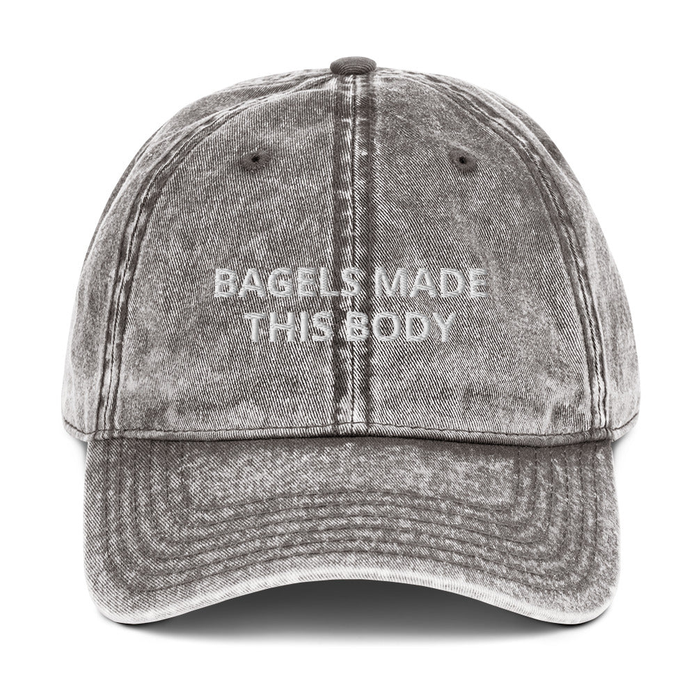 Gray Bagels Hat - Our Bagels Made This Body Hat is comfortable with an adjustable closure and a funny bagel saying, expertly embroidered on the front. Eat bagels and make a statement in this bagels hat. Looking for something personalized? Shoot us a message!