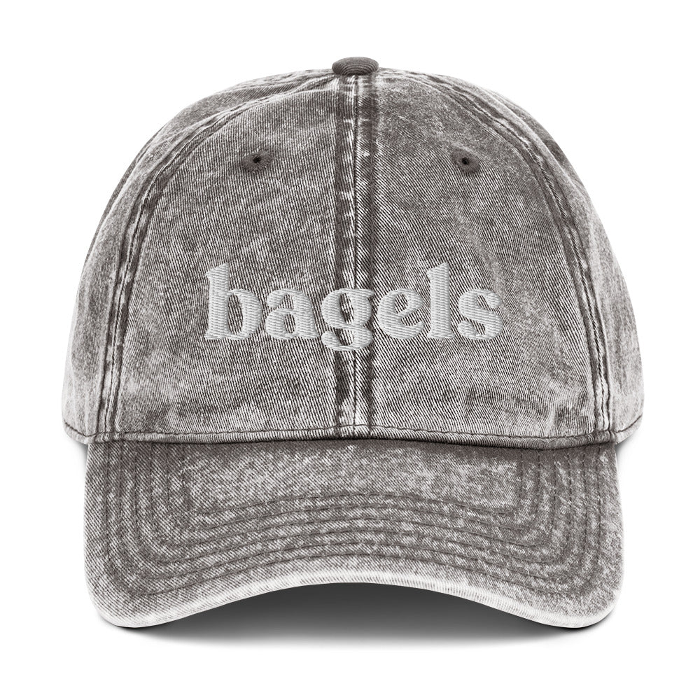 Gray Bagels Hat - Love bagels? This bagels hat is adjustable, comfortable and made just for you. It's a classic dad hat with "bagels", expertly embroidered on the front. Eat bagels and make a statement in this funny hat for bagel lovers. Perfect for everyday streetwear or a gift for a bagel enthusiast. 