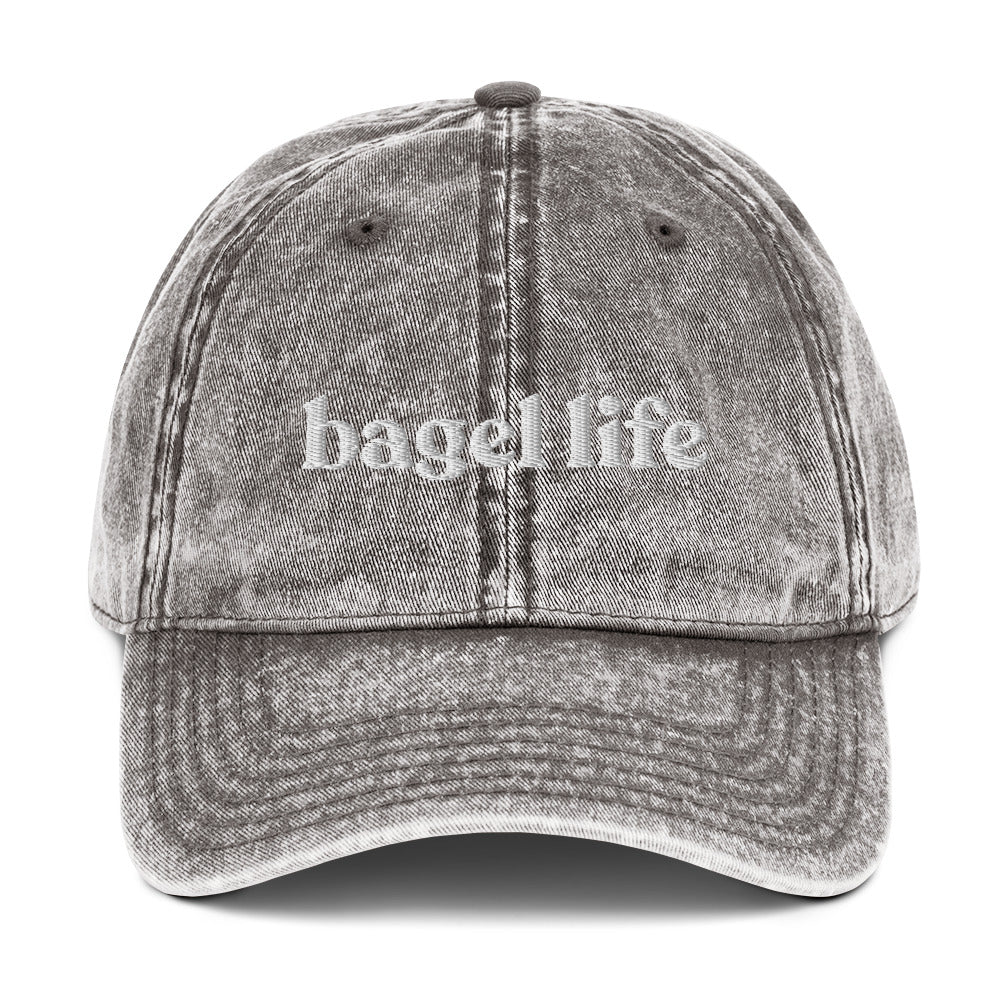 Gray Bagel Life Hat - Living that bagel life? Looking for a gift for a bagel enthusiast? This bagel hat might be just for you. It's a funny bagel hat that's expertly embroidered and made just for you. Make a statement and eat your favorite bagels in this funny Jewish hat. The perfect foodie hat for bagel lovers and foodies of all kinds.