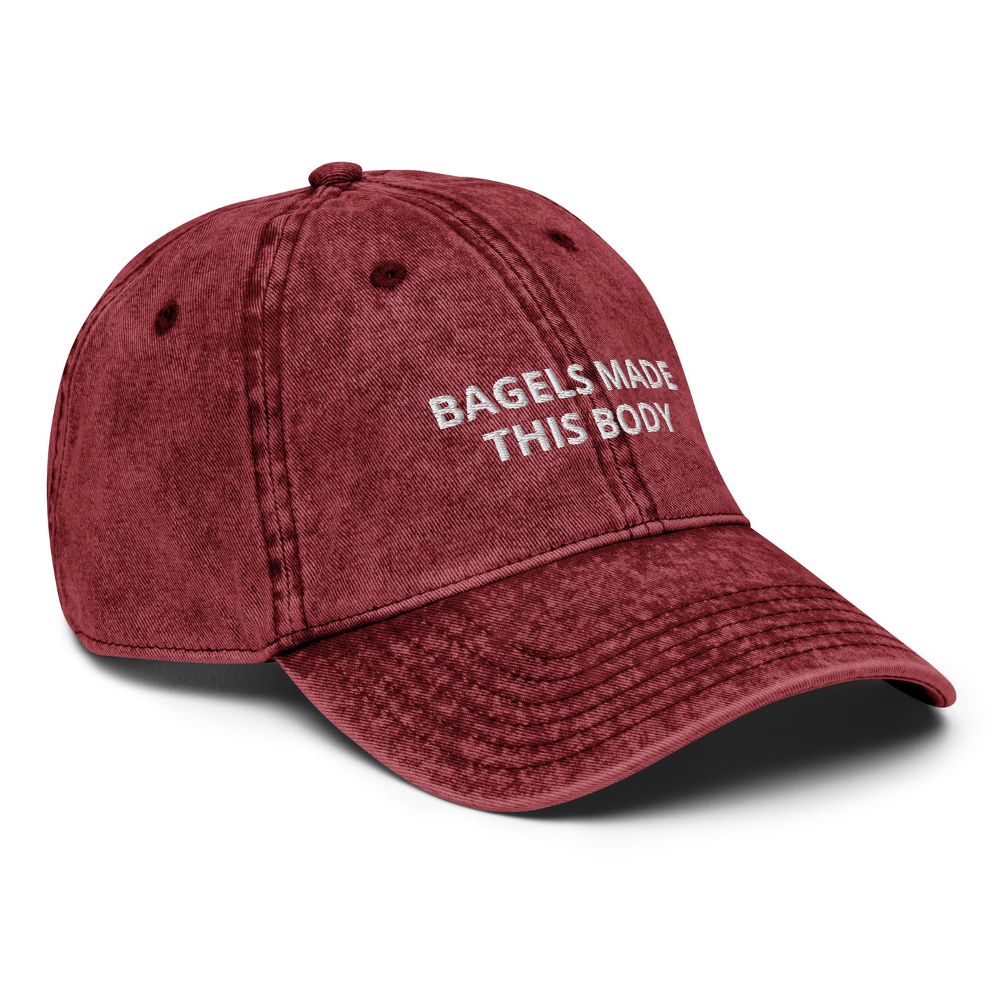 Maroon Bagels Hat - Our Bagels Made This Body Hat is comfortable with an adjustable closure and a funny bagel saying, expertly embroidered on the front. Eat bagels and make a statement in this bagels hat. Looking for something personalized? Shoot us a message! 