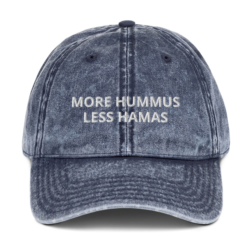 Blue More Hummus Less Hamas Hat - Hamas sucks! Let your hat do the talking in this More Hummus Less Hamas Hat. It's a comfortable cotton hat with an anti-Hamas saying, expertly embroidered on the front. Stand out and make a statement in this classic dad hat against terrorism.