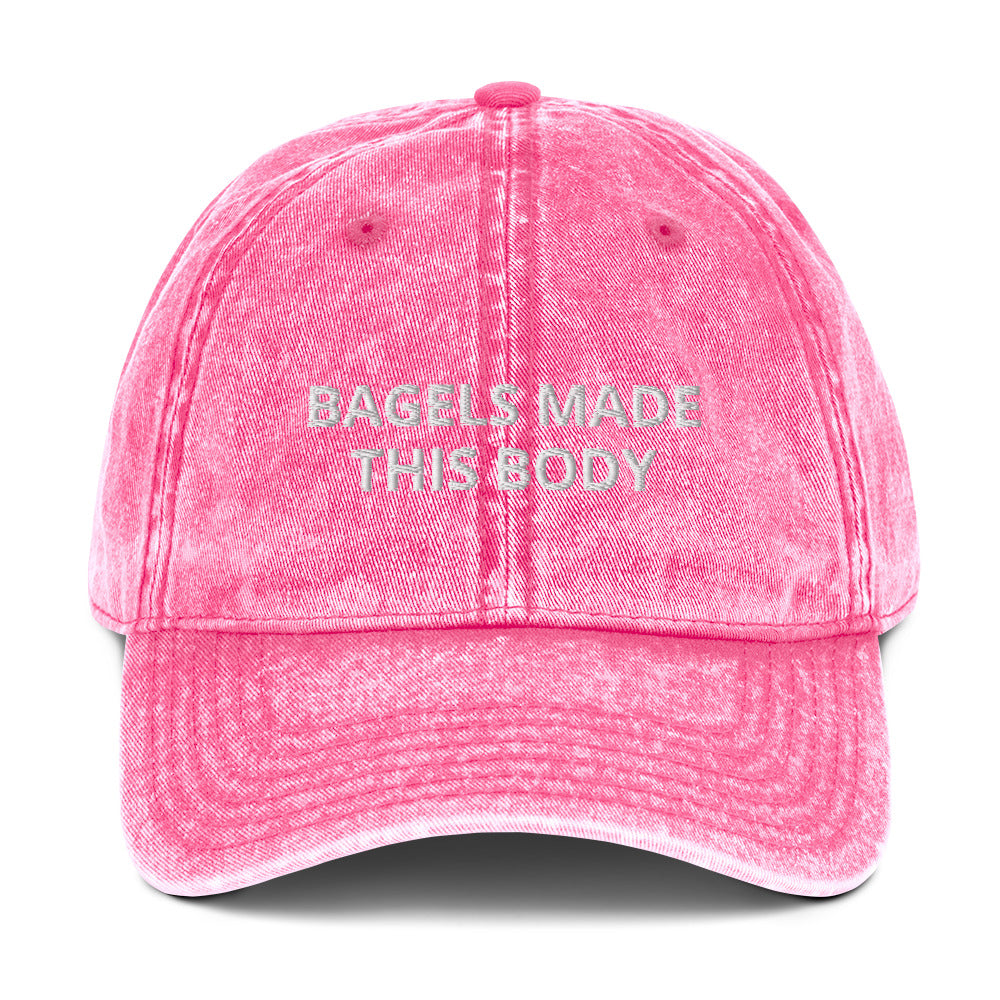 Pink Bagels Hat - Our Bagels Made This Body Hat is comfortable with an adjustable closure and a funny bagel saying, expertly embroidered on the front. Eat bagels and make a statement in this bagels hat. Looking for something personalized? Shoot us a message!