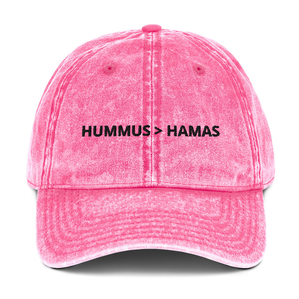 Pink Hummus is Greater Than Hamas Hat - More Hummus Less Hamas! This dad hat is not just for dads! It's a comfortable cotton hat, expertly embroidered with the anti-terror phrase "HUMMUS > HAMAS". Eat your favorite hummus and let your hat do the talking. This anti-Hamas hat is sure to make a statement. Shop more sarcastic Israel foodie hats at Limonarak!